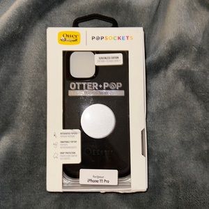 Otterbox pop sockets, defender series, fits iPhone 11 Pro in black with silver.